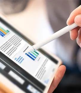 Man writing on his tablet with a stylus
