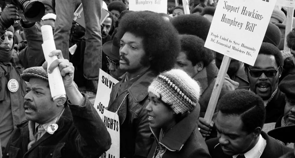 Photo of Jesse Jackson protesting in a crowd