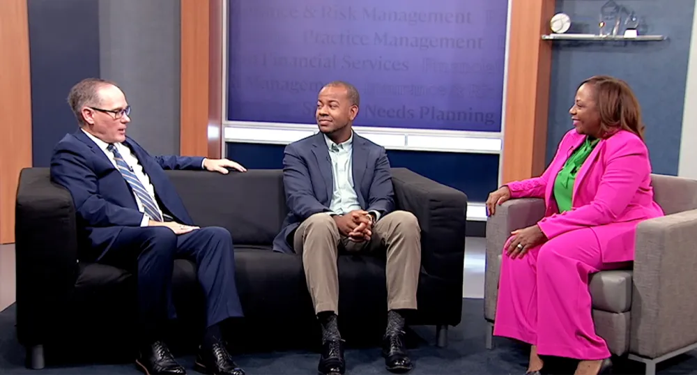 Terry Parham Jr, Terrell Dinkins, and Scott Winslow sitting and talking to each other