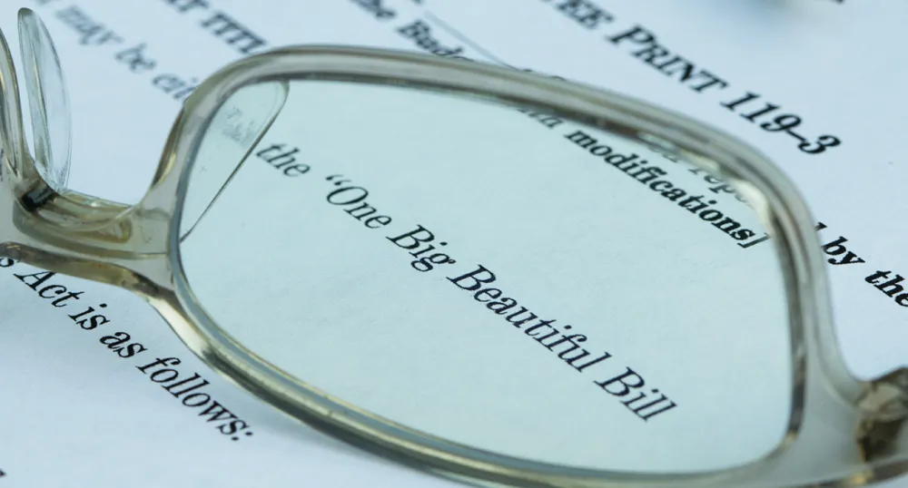 Eye glasses laying on top of an open letter