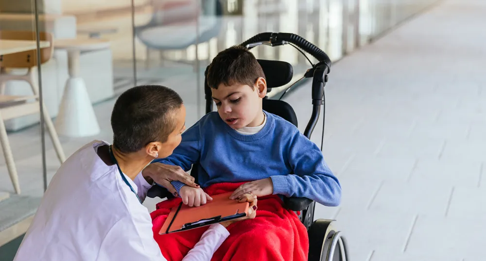 Nurse taking care of a special needs child