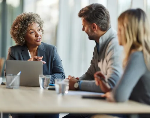Female advisor meeting with married couple