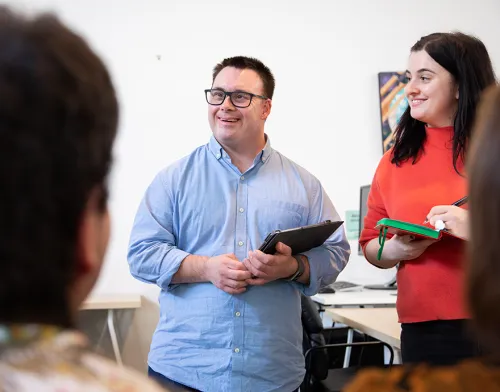 Special needs man presenting in his classroom