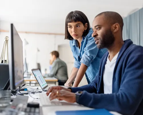 Male and female coworkers working together at the office