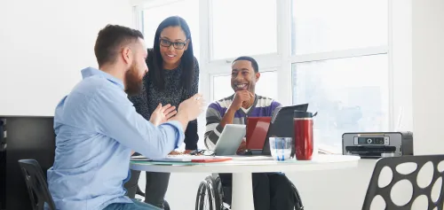 A financial advisor talking to a couple with special needs