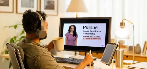 Man sitting at his computer taking a Pursue course online