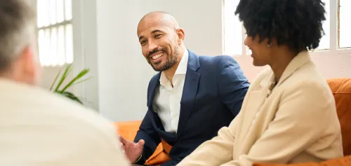 Married couple meeting with their wealth advisor
