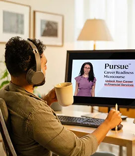 Man in his 30's sitting at the computer taking the Pursue course