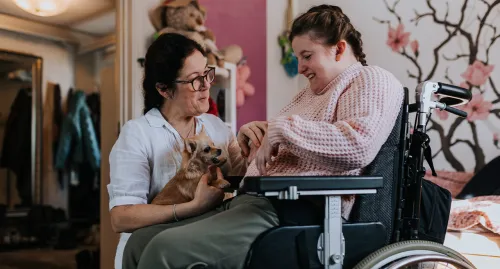 Woman caring for woman with special needs
