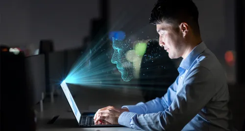 Businessman working on his laptop at night