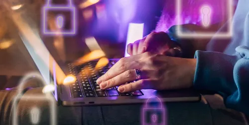 Woman typing on her laptop