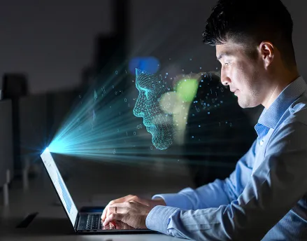 Businessman working on his laptop at night