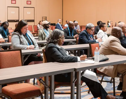 Attendees sitting in a conference hall