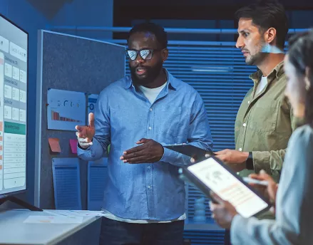 A work team looking at data and analytics together