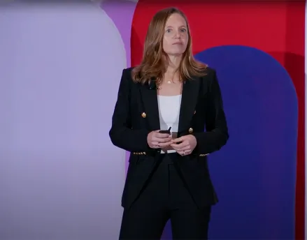 Fiona Greig speaking on stage