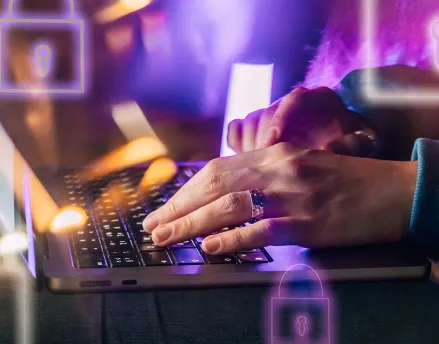 Woman typing on her laptop
