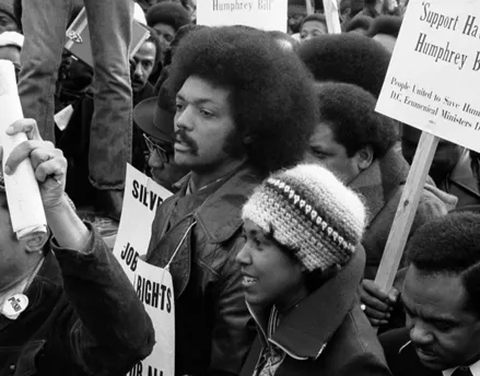 Photo of Jesse Jackson protesting in a crowd