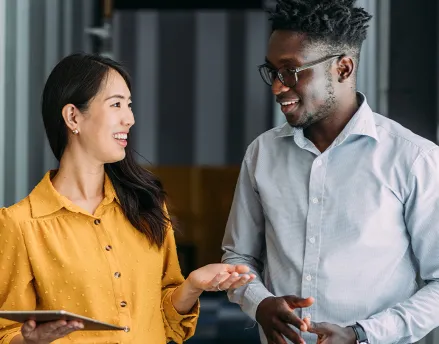 Female financial advisor speaking with her young client