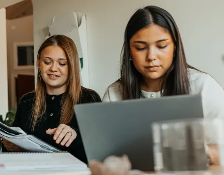 Two Gen Z females studying at their desk