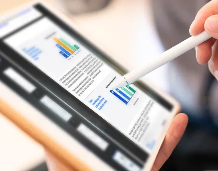Man writing on his tablet with a stylus