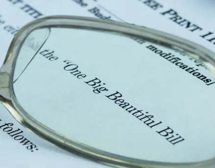 Eye glasses laying on top of an open letter