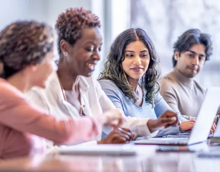 Group of diverse coworkers sitting together