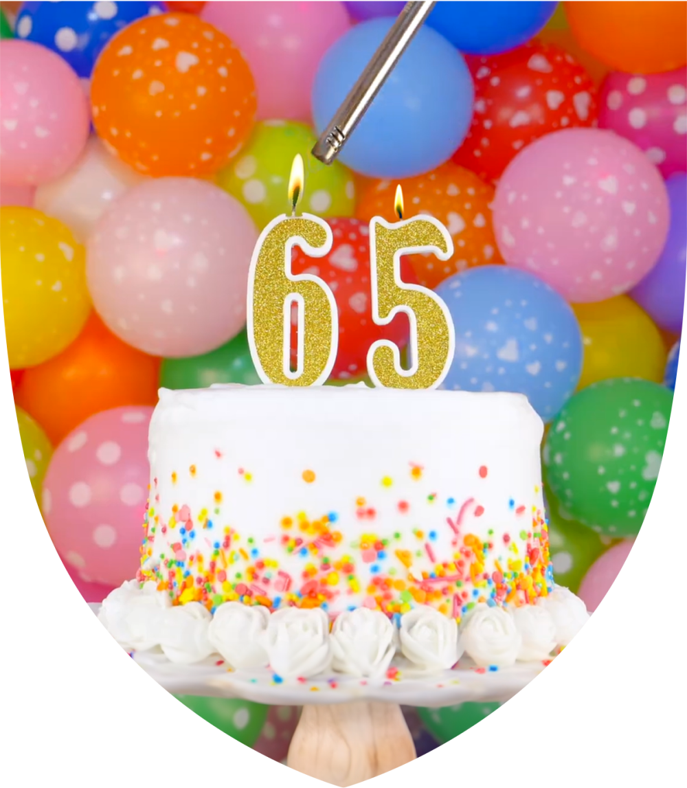 Birthday cake with the number 65 candles in it